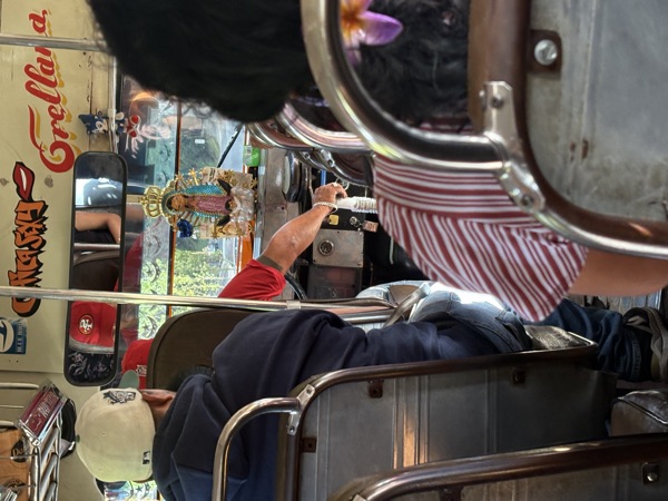 Inside a crowded chicken bus