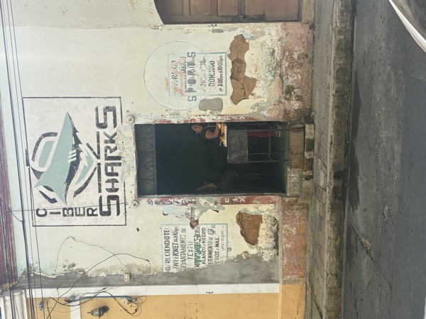 Shop front with a Ciber Sharks sign